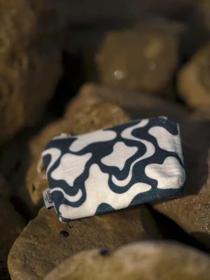 Covery waist bag in the seaside print, worn across the back